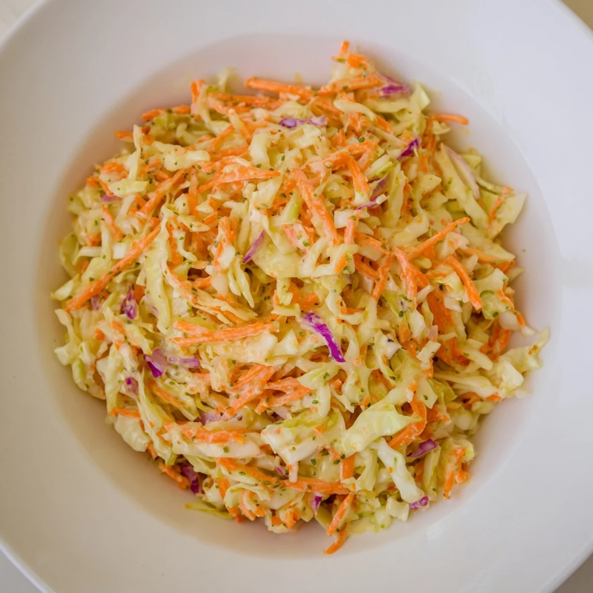 Vibrant Coleslaw, a perfect American side with tangy dressing and crunchy vegetables, ready to serve.