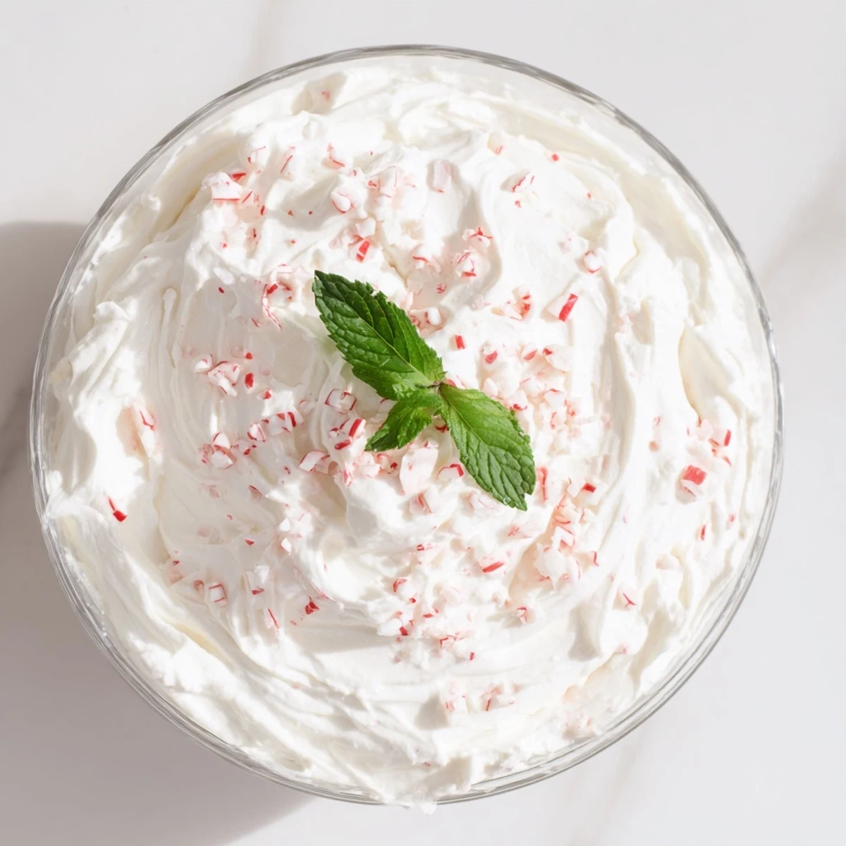 Cream Peppermint dessert, chilled and garnished with crushed peppermint candies, looks so refreshing.