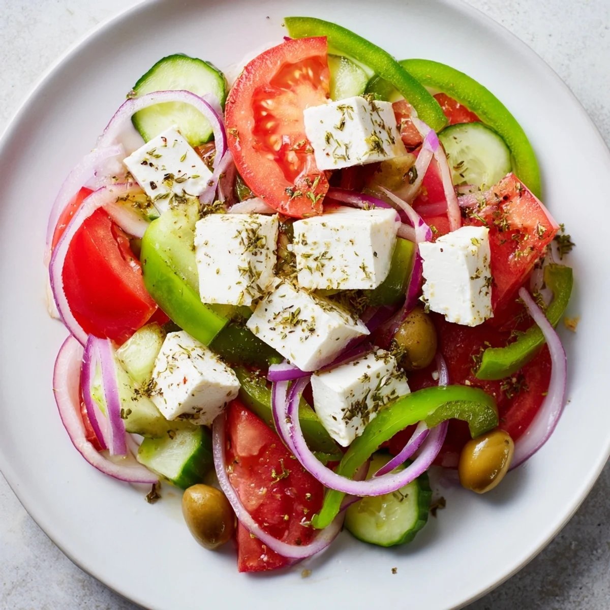 A colorful Greek Salad with Kalamata olives, feta, and a bright, zesty dressing.