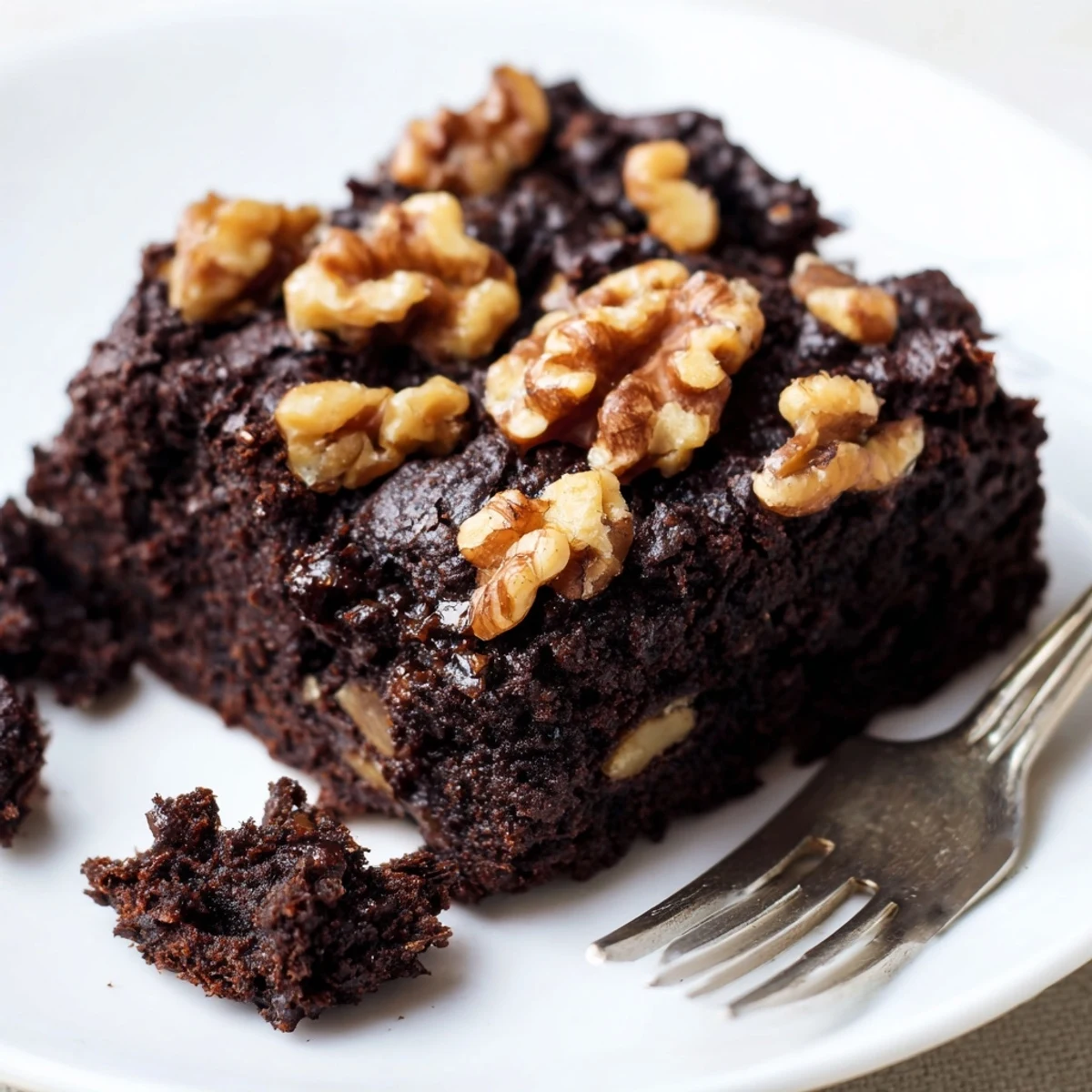 Freshly baked Chocolate Fudge Brownies with Chopped Walnuts cooling on a wire rack, showcasing a rich, fudgy texture and a crackly top.