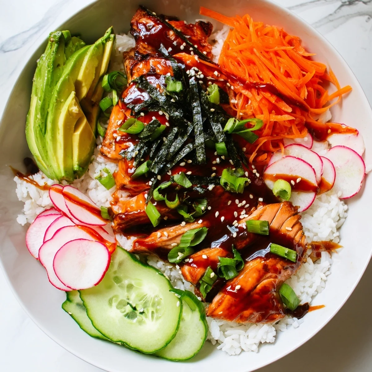 In this Teriyaki Salmon Rice Taco Bowl, tender salmon rests on fluffy rice beside colorful pickled carrots and cucumbers.