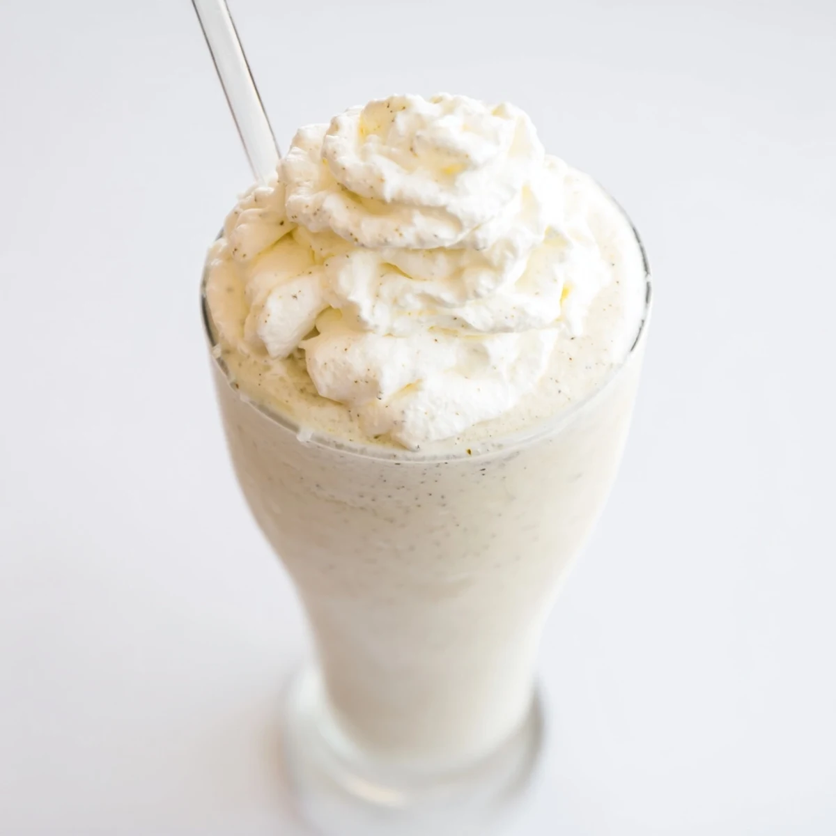 Cold Vanilla Bean Frappuccino blended with ice and creamy vanilla ice cream for a refreshing treat.