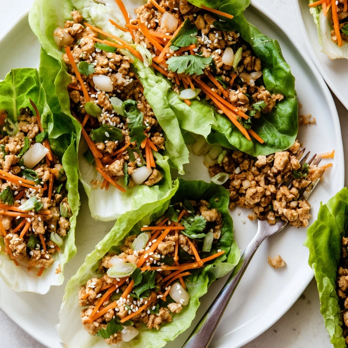 Ready-to-serve Potsticker Chicken Lettuce Boats for a light, low-carb meal, presented with a small bowl of dipping sauce.