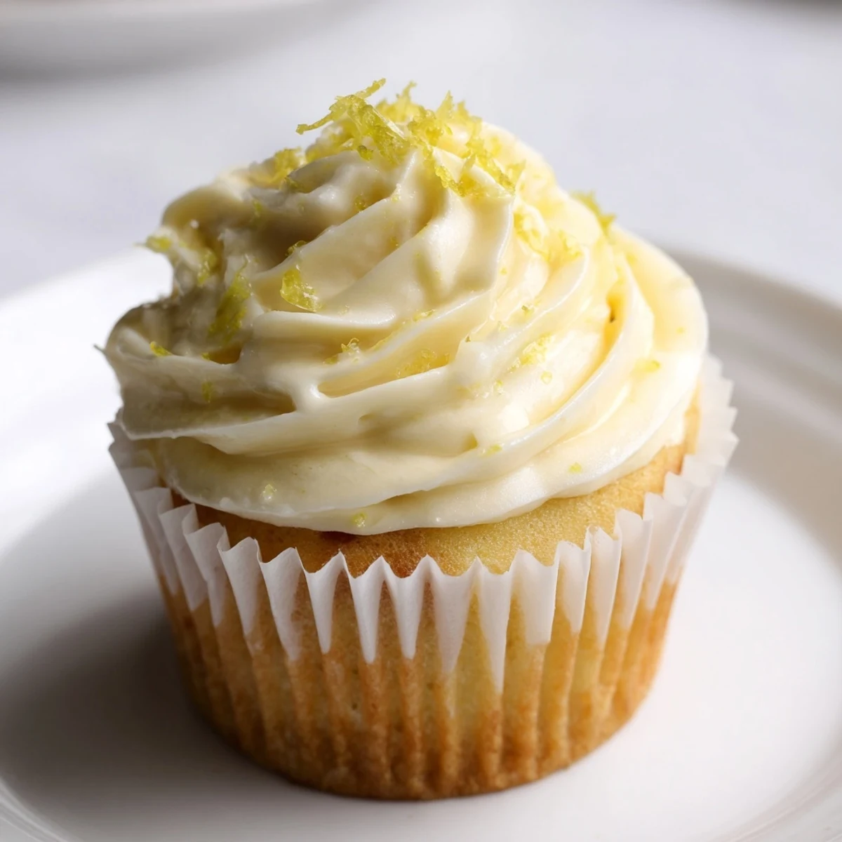 Moist Elderflower Cupcakes with pastel buttercream swirls, ready to serve at a sunny garden gathering.