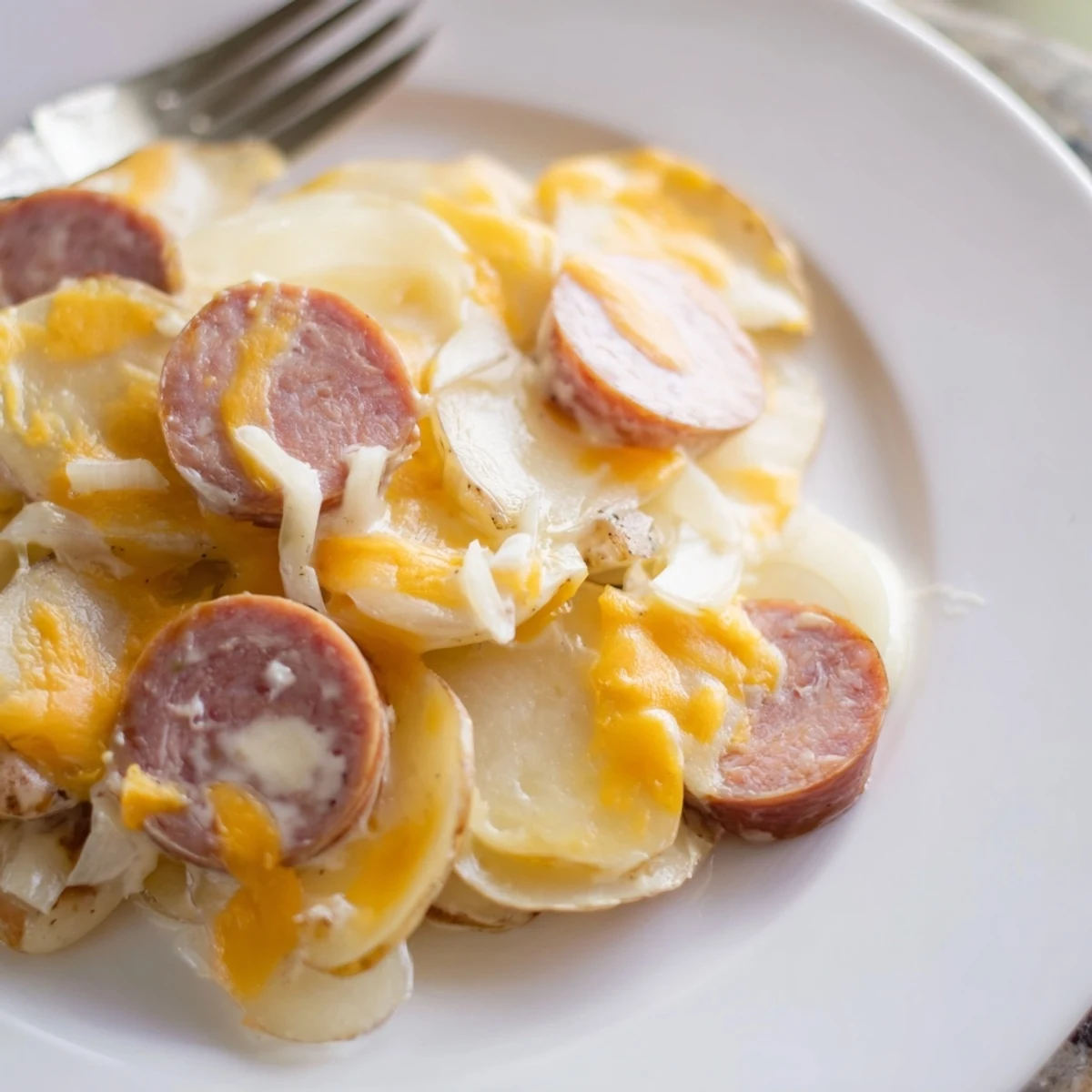 Tender sliced potatoes and smoky kielbasa slow-cooked in rich cheesy sauce