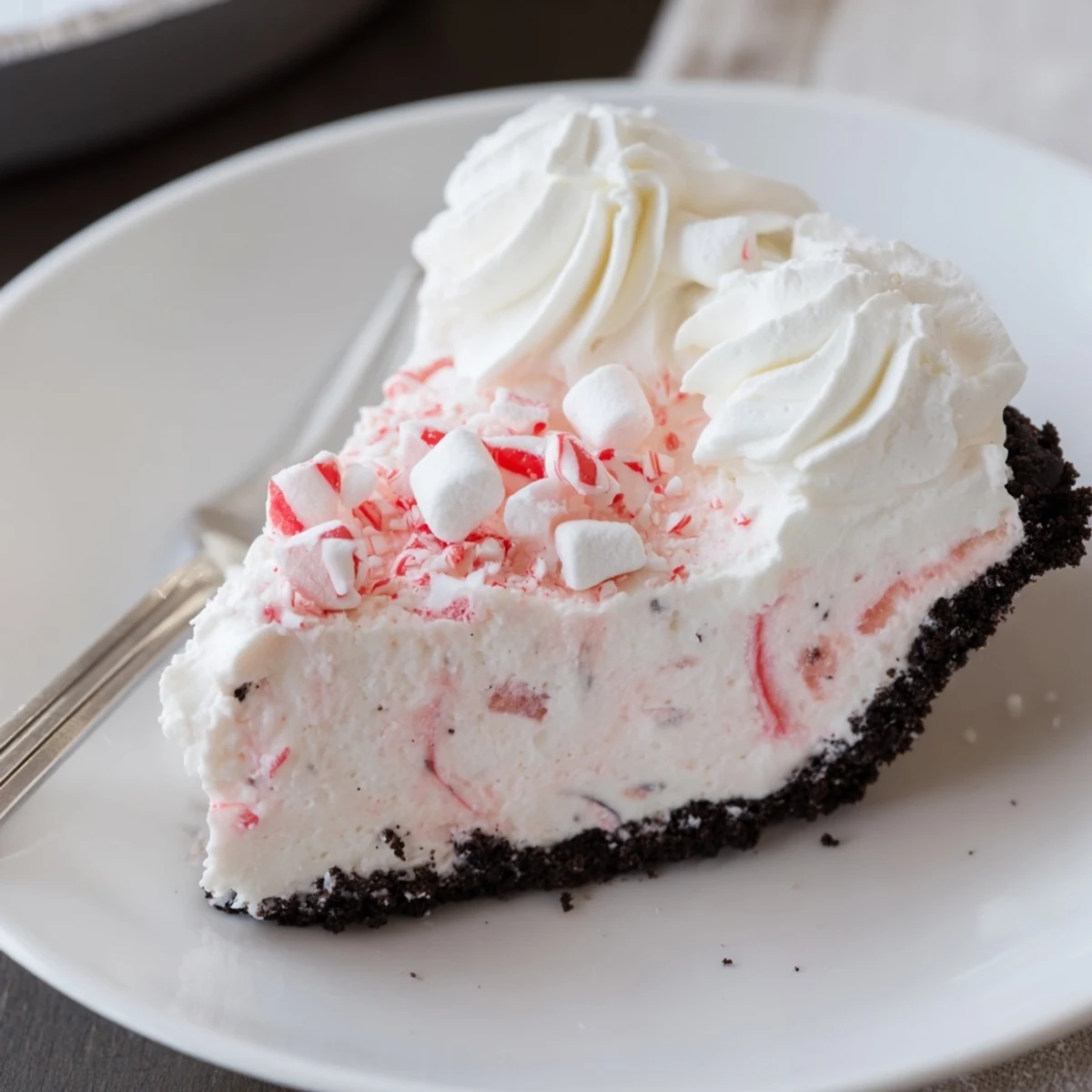 Candy Cane Pie with creamy peppermint filling, chocolate crust, crushed candy topping