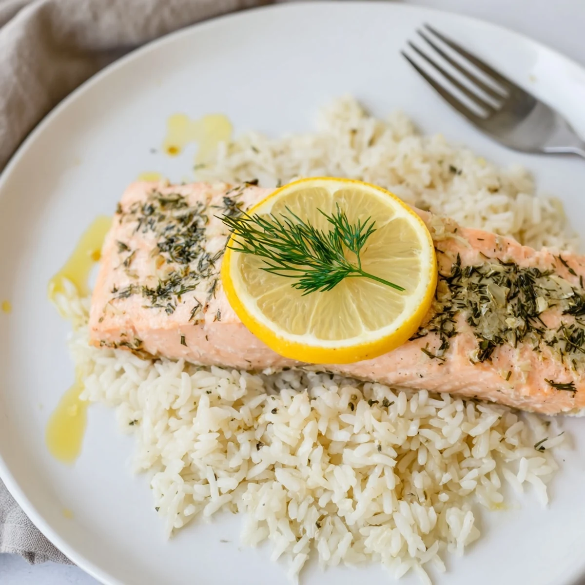 Golden fillets sit on fluffy, herb-scented rice — Baked Salmon and Dill Rice.