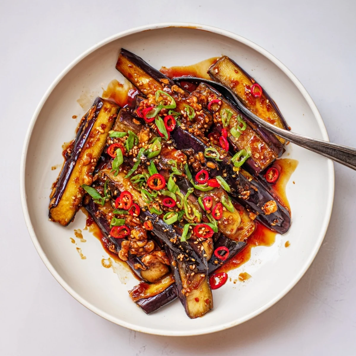 Wok-tossed Sichuan Style Braised Aubergines with fiery doubanjiang, fragrant garlic-ginger