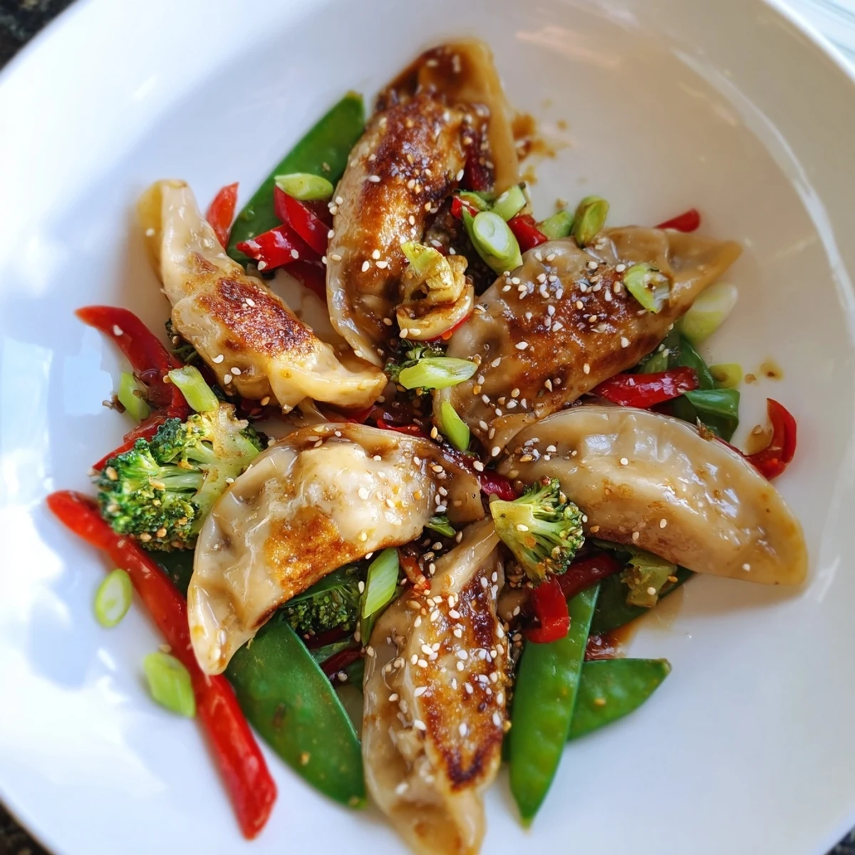 Quick Potsticker Stir Fry sizzling in a wok with vibrant vegetables, toasted sesame seeds