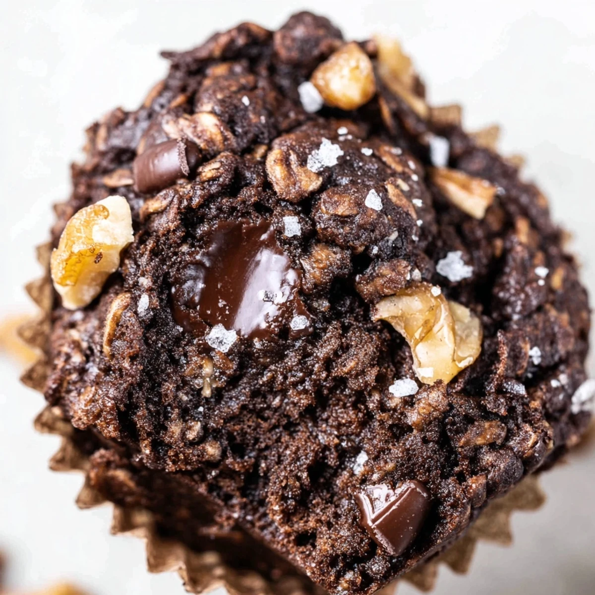 Portable dark chocolate oatmeal cups topped with chocolate chips and sea salt sprinkles
