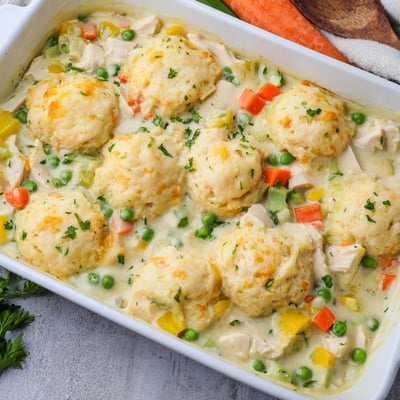 Freshly baked Red Lobster Biscuit Chicken Pot Pie shows cheddar biscuits topping a rich chicken and vegetable mixture.